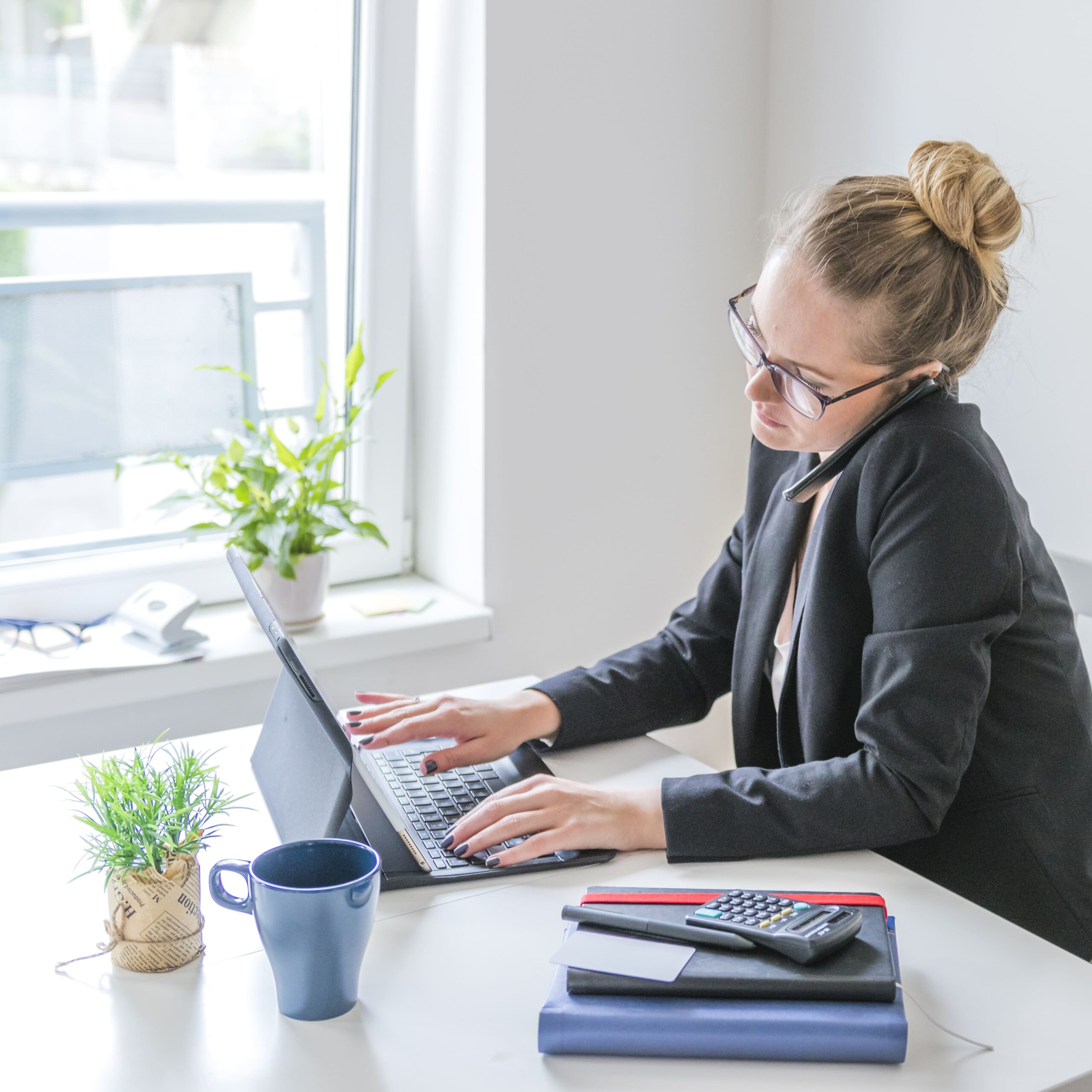 businesswoman-working-laptop-using-cellphone-office (1) businesswoman-working-laptop-using-cellphone-office (1)